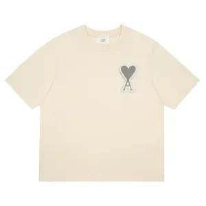 AMI Paris Oversized Logo-Appliquéd Cotton-Jersey T-Shirt Cream